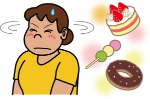 甘いものを我慢している女性